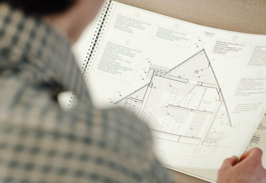 Septic site plan and OSSF permit paperwork on a clipboard at an East Texas jobsite